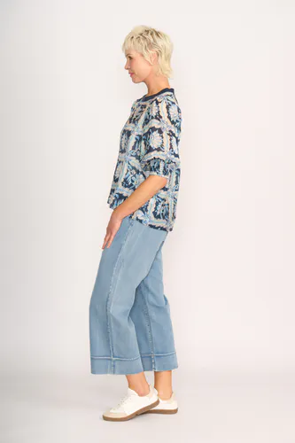 Model wearing Denim Floral Check Leopard Rib Trim Blouse By Memo Available at Beetees Nelson